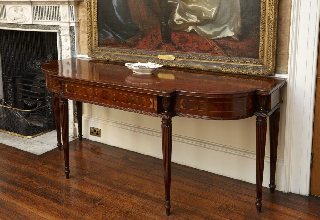 Photograph of a mahogany carving table.