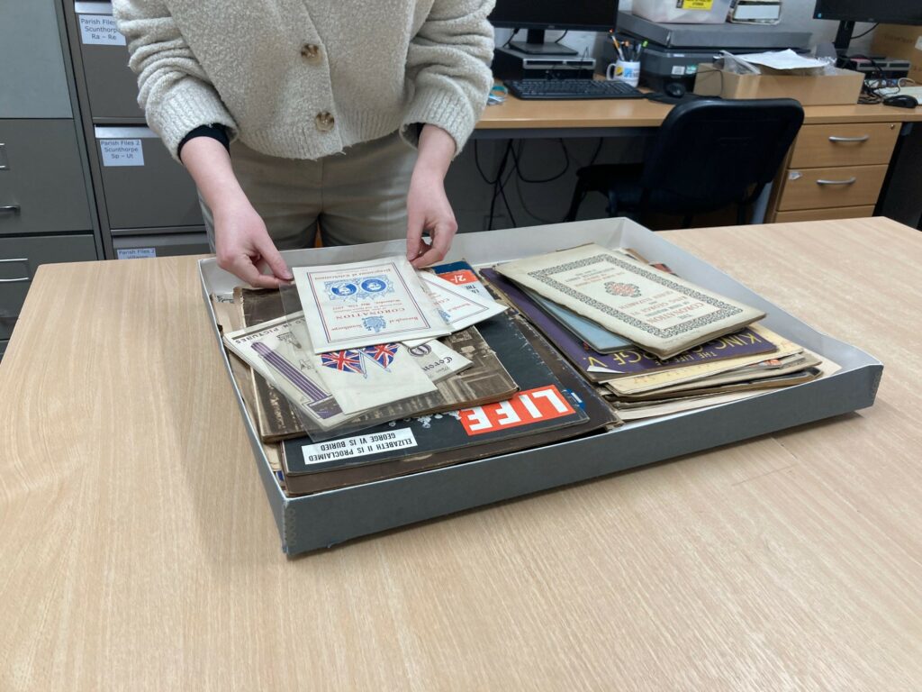 pair of hands getting some files out of a box