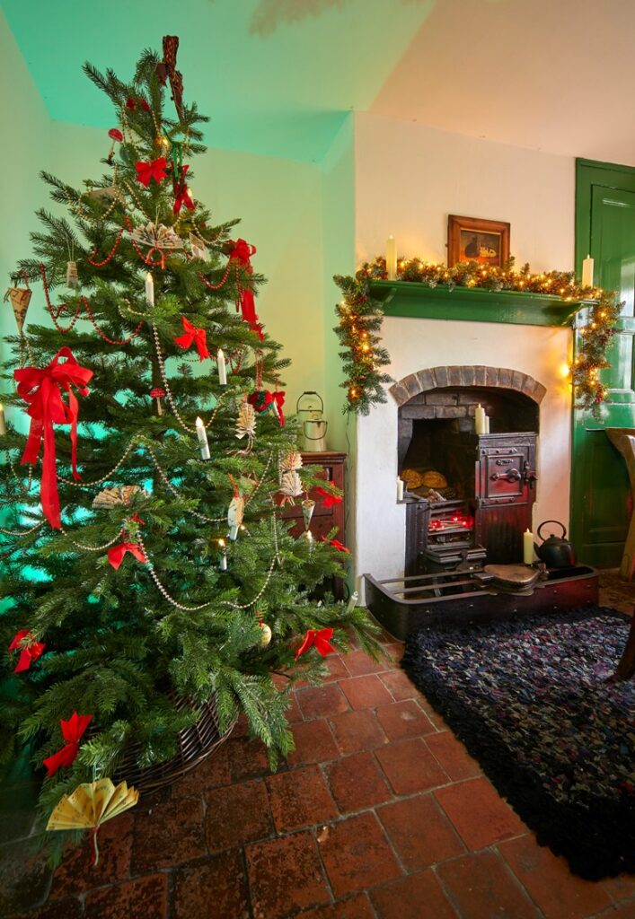 Ironstone cottage fireplace decorated for Christmas